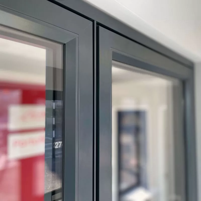 A grey flush aluminium casement window